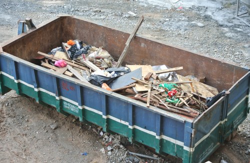 Professionals conducting loft clearance in Brompton